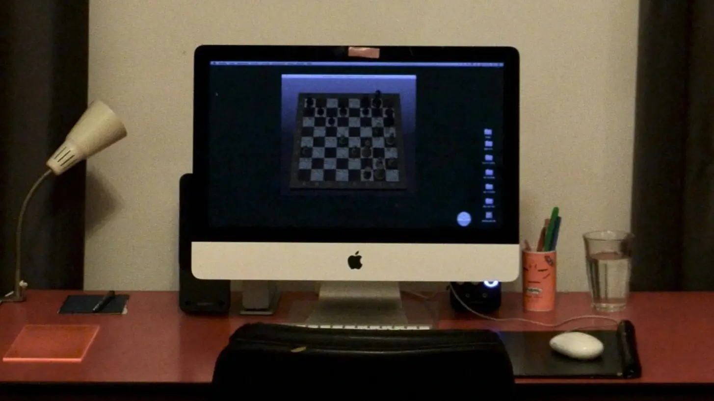 Computer with a chess board illustrating best free chess websites for playing, learning, and improving chess skills online